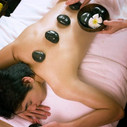 high-angle-view-woman-giving-massage-man-spa_1048944-8679858